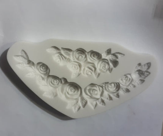 Silicone mold with rose designs on a white background