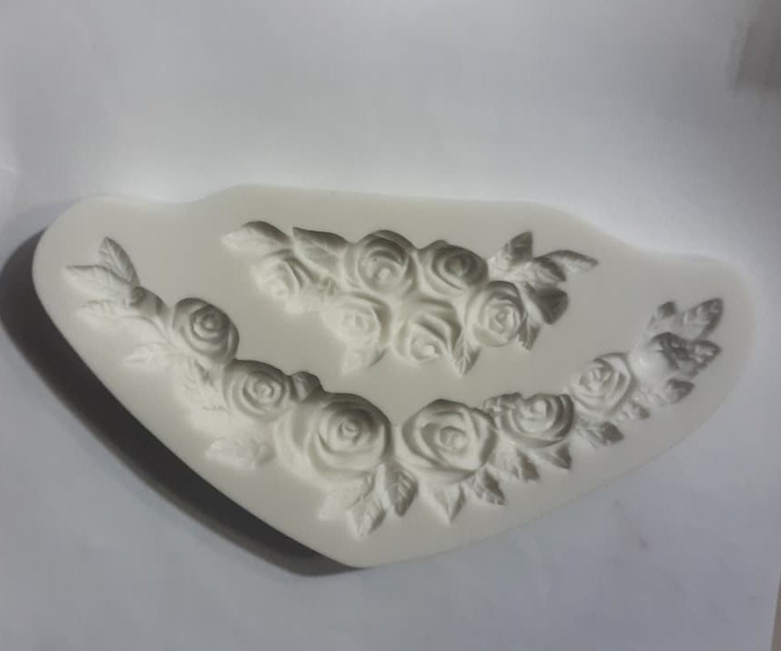 Silicone mold with rose designs on a white background