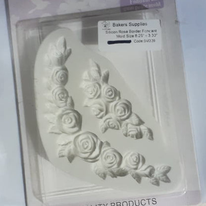 Silicone mold with floral design in packaging on a light surface
