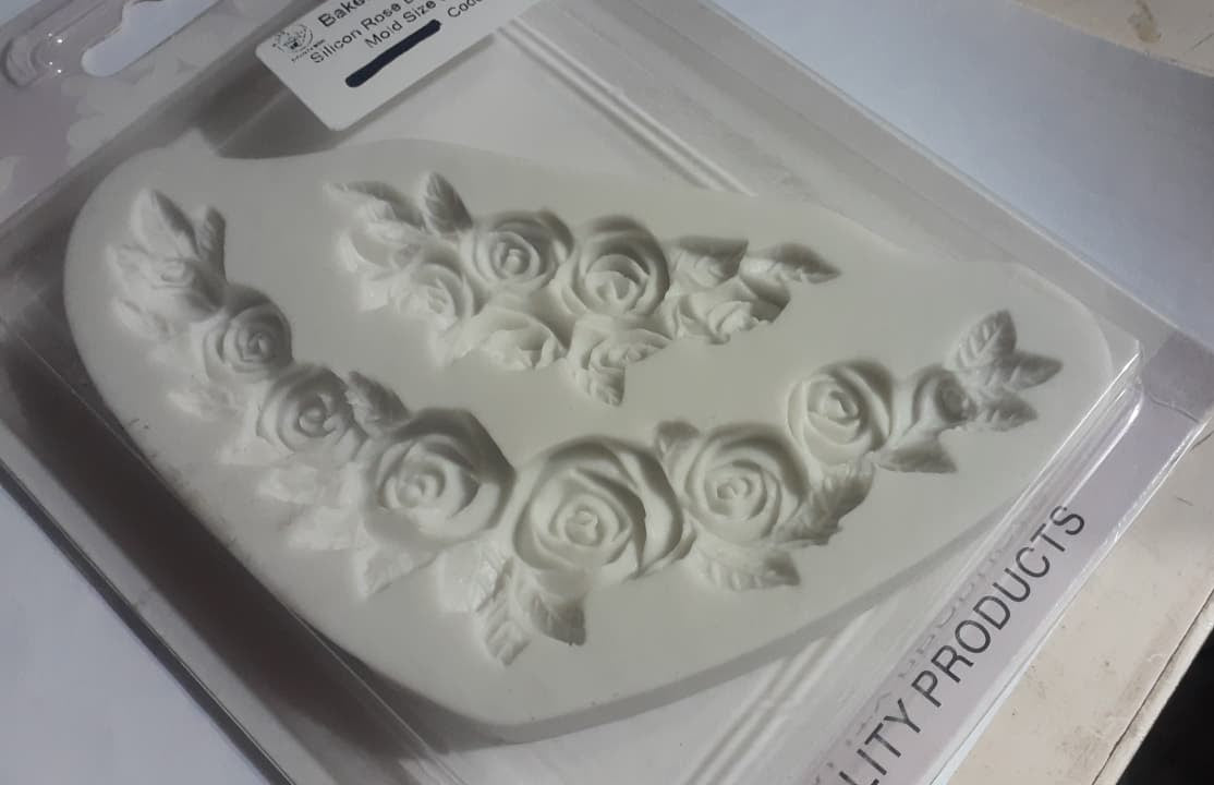 Silicone mold with floral designs on a white background